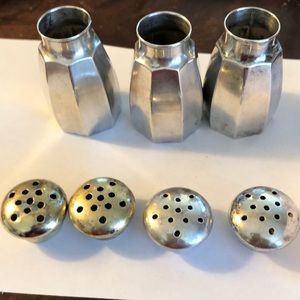 Salt and pepper shaker 3 with 4 lids . 1 3/4 in tall one in base octagon shape.